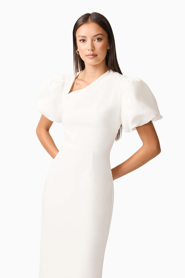 Brunette model wearing the Hester Puff Sleeve Midi Dress in White close up shot