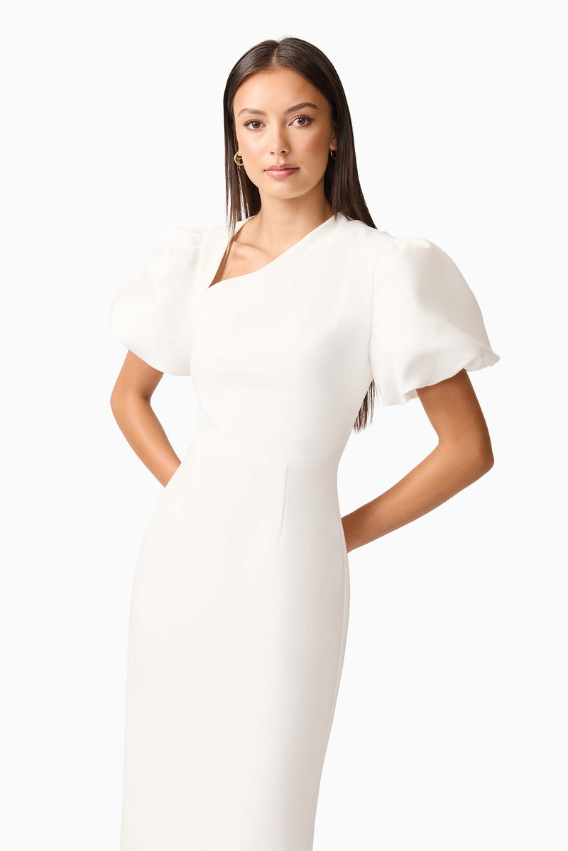 Brunette model wearing the Hester Puff Sleeve Midi Dress in White close up shot