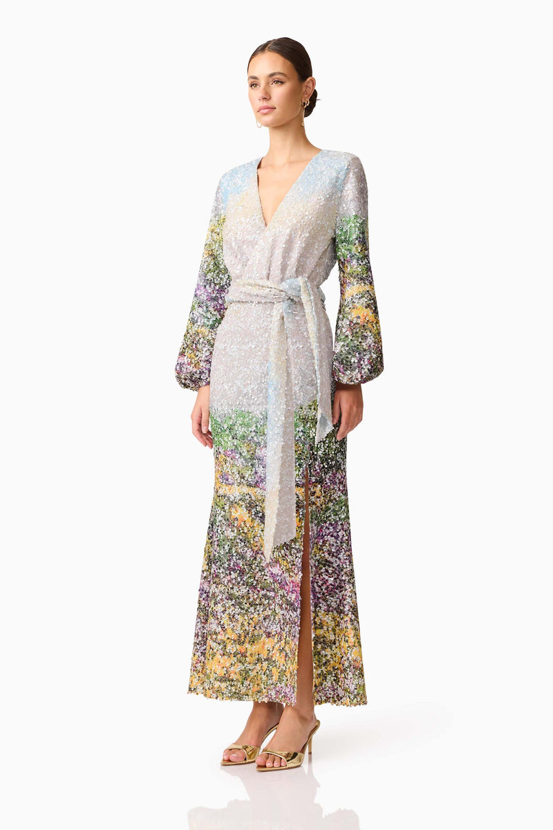 Brunette model wearing the Arden Long Sleeve Gown in Multi Ombre side shot