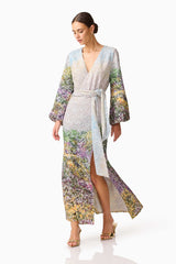 Brunette model wearing the Arden Long Sleeve Gown in Multi Ombre posed shot