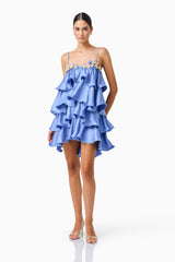 Poselia Tiered Mini Dress in Slate Blue with square neckline & 3D floral trim posed front shot