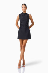 Zinelle A-Line Mini Dress in Black with asymmetrical neckline posed shot