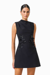 Zinelle A-Line Mini Dress in Black with asymmetrical neckline close up shot