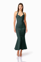 Virella Halter Gown in Dark Green with a v-neckline & mermaid skirt posed shot