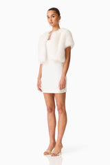 Brunette model wearing the Lucyna Short Sleeve Bolero in White Side Shot