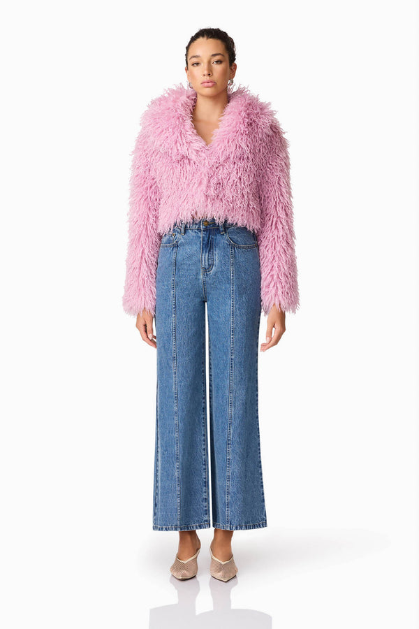 Brunette model wears Trisha Faux Fur Cropped Jacket in Pink Front Shot