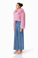 Brunette model wears Trisha Faux Fur Cropped Jacket in Pink Side Shot