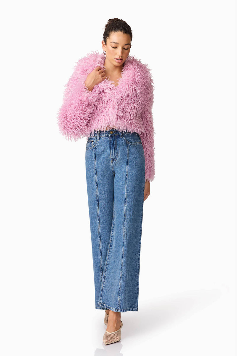 Brunette model wears Trisha Faux Fur Cropped Jacket in Pink Posed Shot 2