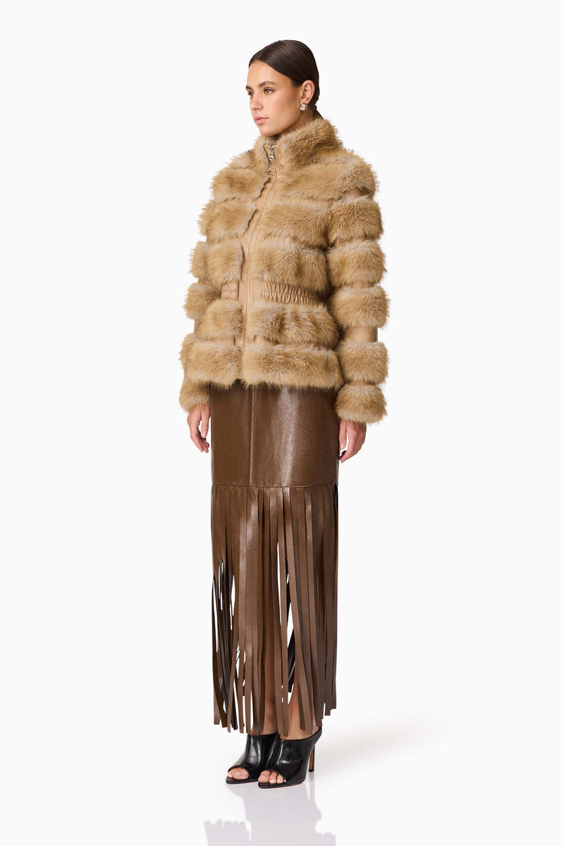 Brunette model wearing Aisling Faux Fur & Leather Jacket in Beige Posed Shot