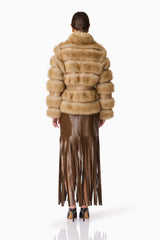 Brunette model wearing Aisling Faux Fur & Leather Jacket in Beige Back Shot