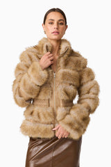Brunette model wearing Aisling Faux Fur & Leather Jacket in Beige Close Up Shot