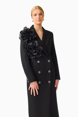 Noiretta Coat in Black with floral applique detailing & front side pockets close up shot 