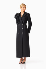 Noiretta Coat in Black with floral applique detailing & front side pockets side looking away shot 
