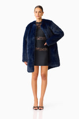 Oribela Fur Coat in Navy Blue hand on hip posed shot