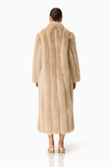Brunette model Faux Fur Maxi Coat in Biege back shot