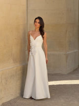 Brunette model wearing the Stella A-Line Gown in White campaign shot 