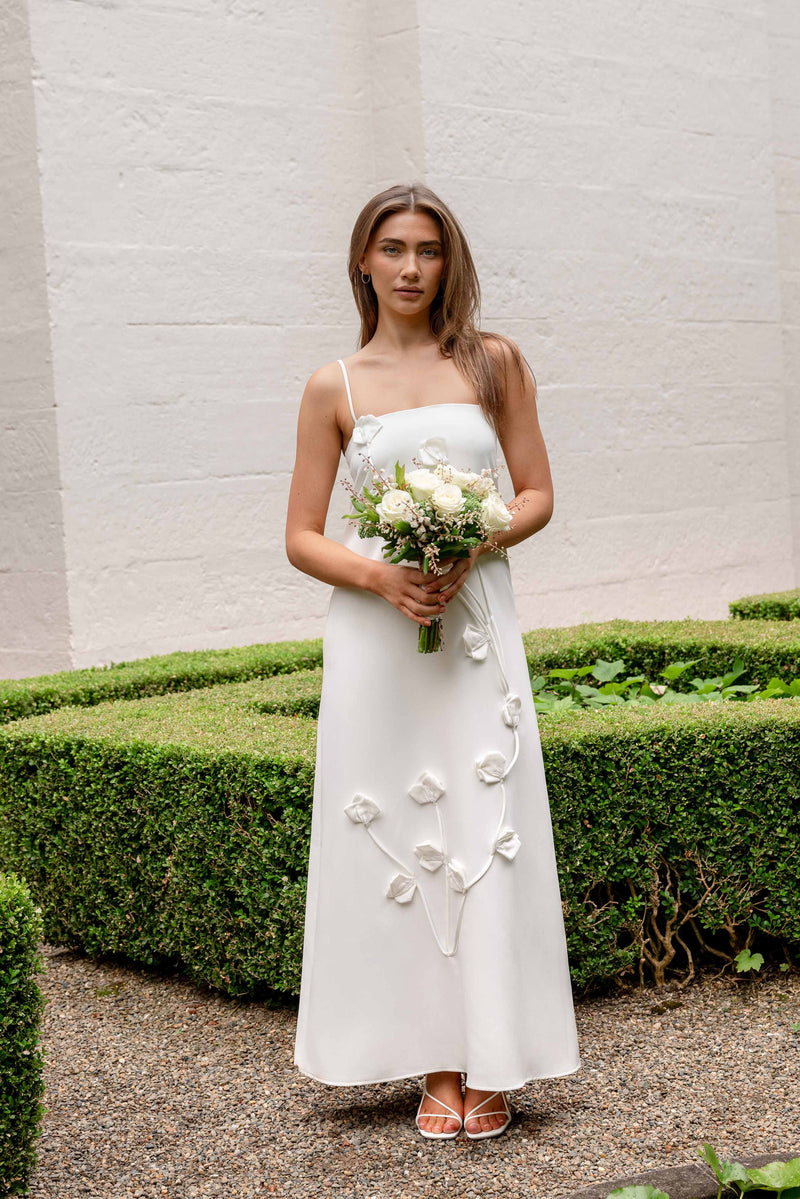 white dress with floral applique Nolana Floral Applique Gown in White – Elliatt