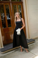 Brunette model wearing the Ruelle A-Line Maxi Dress in Black campaign shot