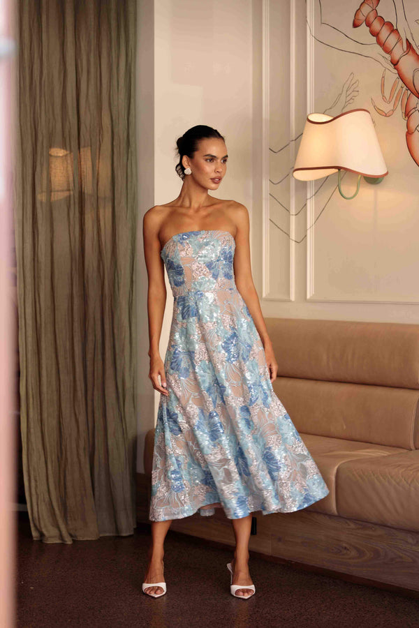 Brunette model wearing Leonie Cocktail Midi Dress in Blue campaign shot