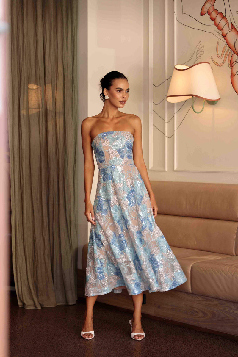 Brunette model wearing Leonie Cocktail Midi Dress in Blue campaign shot
