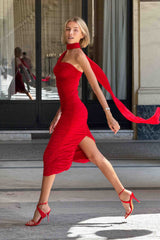 Blonde model wearing Darya Fitted Midi Dress in Red outside walking shot