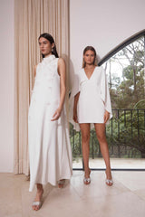 Brunette model on left wears Lilydale Maxi dress in white