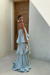 Brunette model wears the Tilly Maxi Dress in Blue