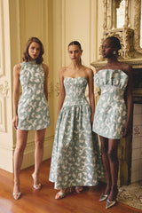 Models wearing the Lisette Sweetheart Gown in Sea Green & Lisette High Neck Mini Dress in Sea Green & Lisette Strapless Mini Dress in Sea Green to a garden day party 