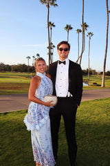 Model wearing the Tulsia Floral Cape Maxi Dress in Light Blue to a destination wedding