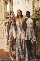 Models wearing Clementina Ruffle MaxDress in Multi Floral, Clementina Halter Mini Dress in Multi Floral & Clementina One Shoulder Mini Dress in Multi Floral to girls lunch