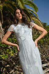 Brunette model wearing the Annabelle Embellished Gown in Blue content shot
