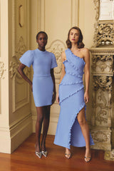 Models wearing Floriana Puff Sleeve Mini Dress in Cornflower & Floriana Asymmetric Gown in Cornflower Blue to a welcome party event 