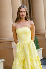 Brunette model wearing the Luella Strapless Gown in Yellow content shoot shot