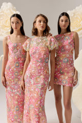 Brunette model wearing the Nathalie Puff Sleeve Gown in Pink Floral campaign shot