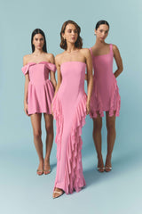 Brunette model wearing the Amelina Strapless Gown in Pink campaign shot