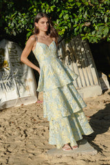 Brunette model wearing the Penelope Tiered Gown in Yellow & Blue Floral content shot