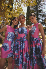 Brunette model wearing the Sybella Ruffle Maxi in Pink & Blue Floral to wedding ceremony