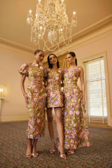 Model wearing the Fiora Puff Sleeve Midi Dress in Green & Pink Floral to welcome party