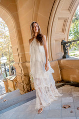 Brunette model wearing Evelin Lace Gown in White content shot