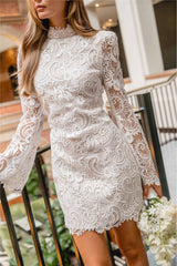 Brunette model wearing the Cora Long Sleeve Mini Dress in White front shot