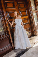 Brunette model wearing the Laurel Sleeveless Maxi Dress in Silver campaign shot