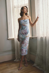 Brunette model wearing the Priselle Strapless Midi Dress in Blue Floral campaign shot