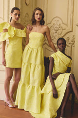 Brunette model wearing the Luella One Shoulder Mini Dress in Yellow campaign shot