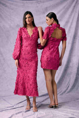 Brunette model wearing Claudia Long Sleeve Midi Dress in Pink posed front campaign shot
