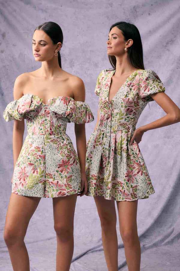Brunette model in Calaantha Puff Sleeve Mini Dress in Floral campaign shot