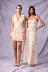 Brunette model wears Livia Mini Dress in White campaign shot