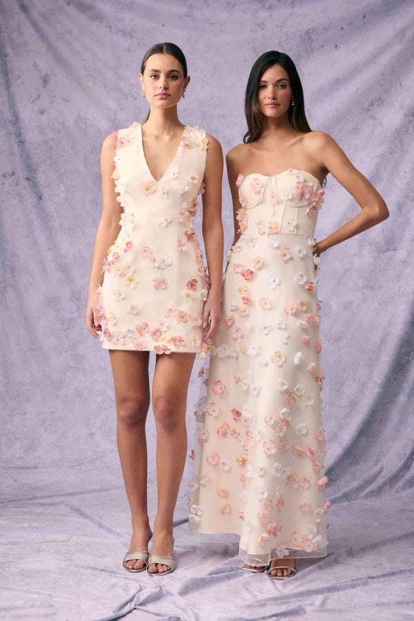 Brunette model wears Livia Mini Dress in White campaign shot