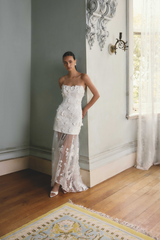 Whynter model wearing the Lorina Strapless Gown in White campaign shot