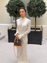 Brunette model wearing the Margot Long Sleeve Gown in White campaign shot