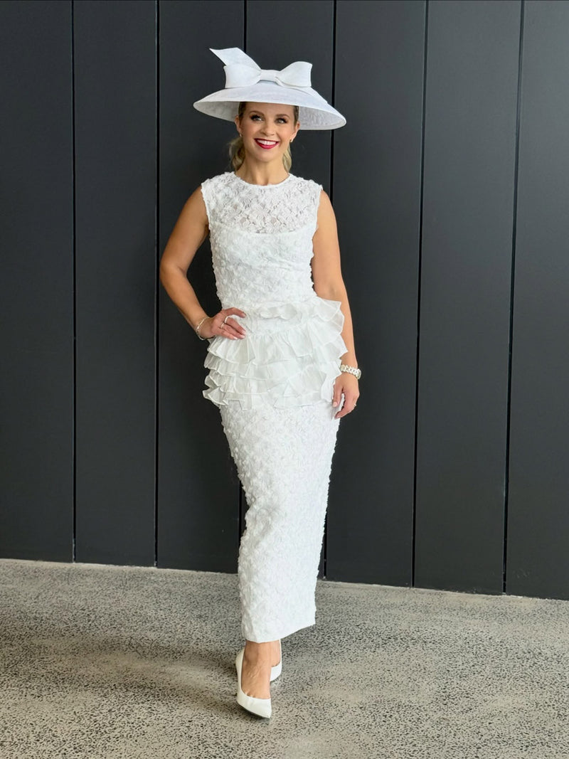 Brunette model wearing Athena Lace Midi Dress in White campaign shot 